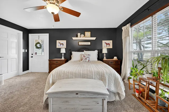 a bathroom with a double vanity sink mirror and next to a window