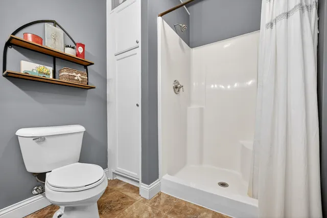 a bathroom with a tub and shower