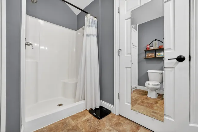 a view of washer and dryer with wooden floor