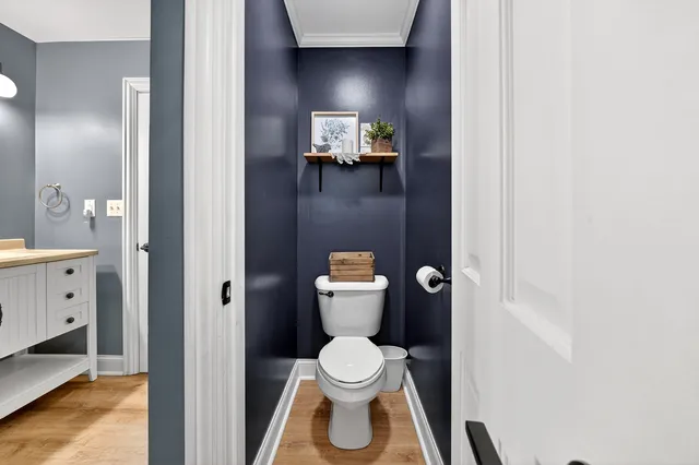 a sign that is sitting in a tall tree