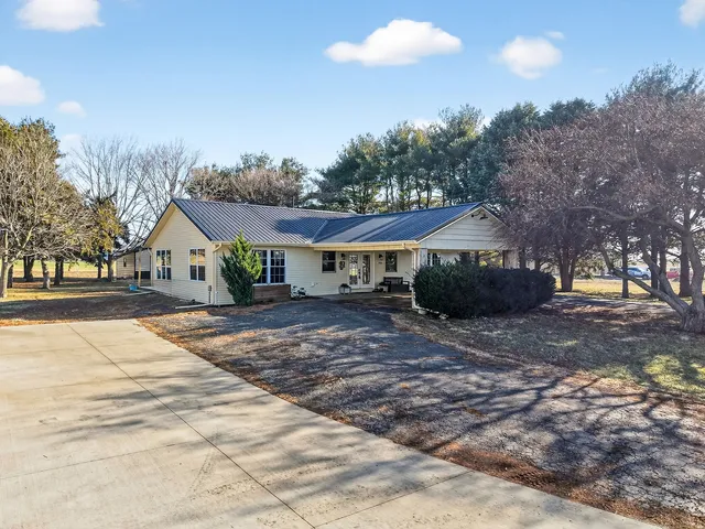 a view of a swimming pool with an outdoor space and seating area