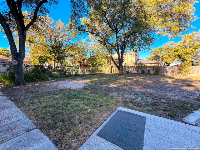 a view of backyard with green space