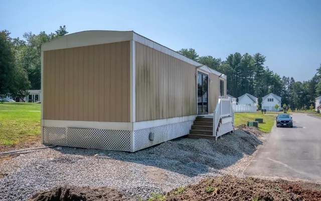 a view of a backyard with swimming pool