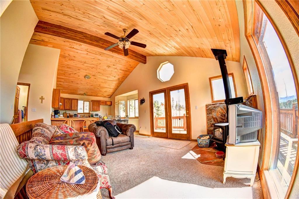 1257 Chippewa Road Como, CO 80456 - Photo 12 of 25 a living room with furniture a large window and chandelier