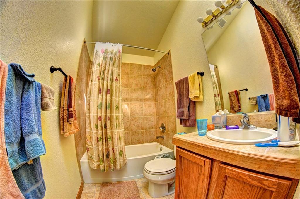 1257 Chippewa Road Como, CO 80456 - Photo 15 of 25 a bathroom with a sink and a mirror
