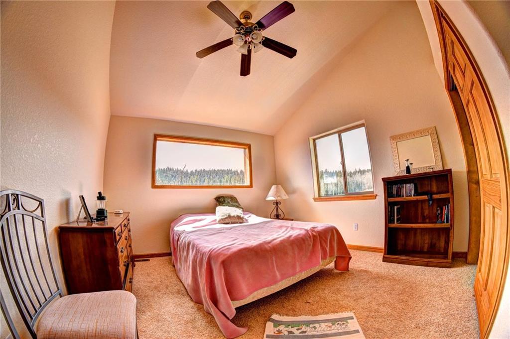 1257 Chippewa Road Como, CO 80456 - Photo 18 of 25 a bedroom with a bed furniture and a large window