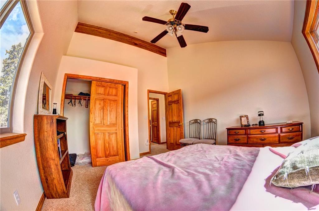 1257 Chippewa Road Como, CO 80456 - Photo 19 of 25 a bedroom with furniture and a window