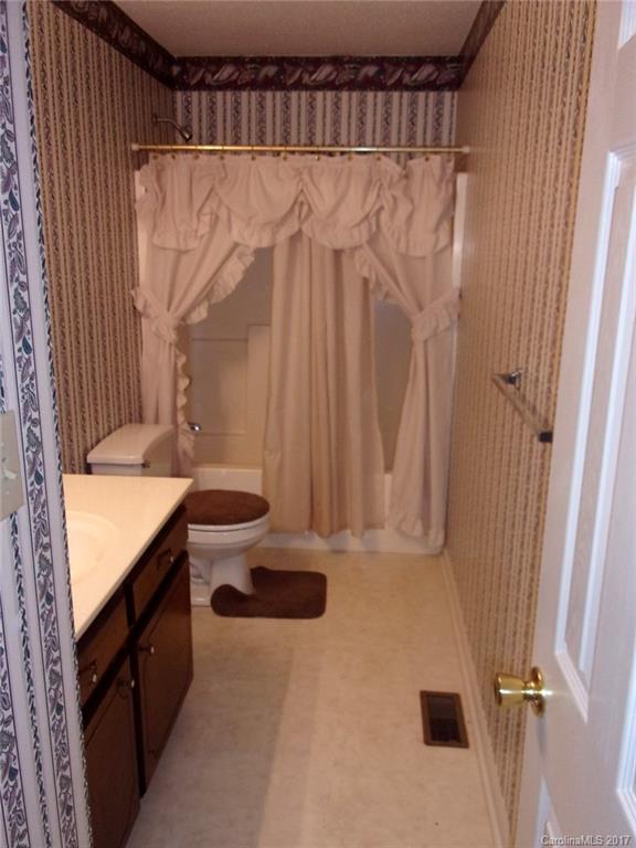 36074 Finger Road, Unit 2 Mount Pleasant, NC 28124 - Photo 12 of 21 a bathroom with a granite countertop sink and a mirror