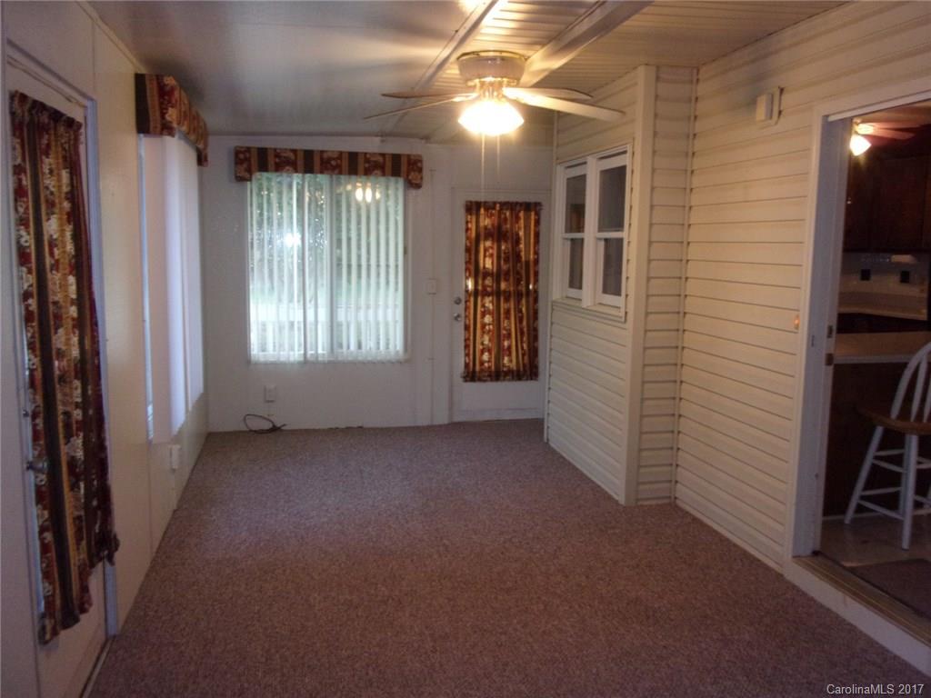 36074 Finger Road, Unit 2 Mount Pleasant, NC 28124 - Photo 16 of 21 a view of a livingroom with an empty space and a window