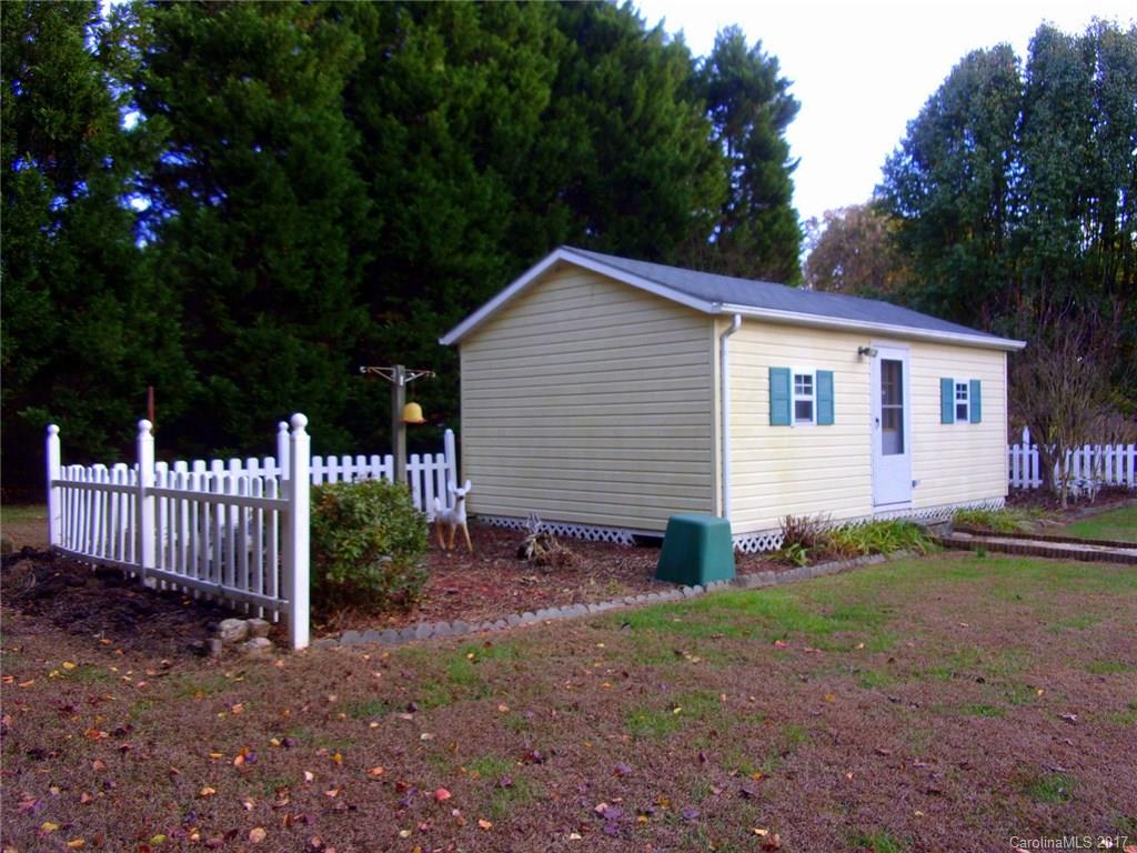 36074 Finger Road, Unit 2 Mount Pleasant, NC 28124 - Photo 18 of 21 a view of a house with backyard and trees