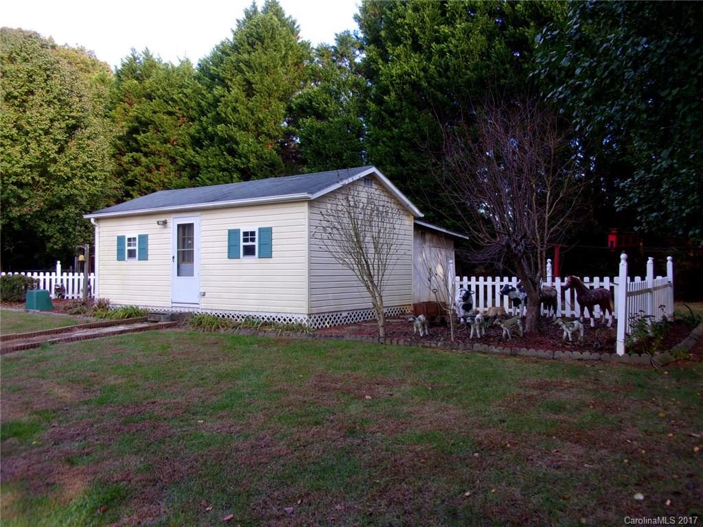 36074 Finger Road, Unit 2 Mount Pleasant, NC 28124 - Photo 19 of 21 a front view of a house with garden