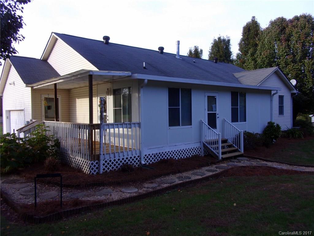 36074 Finger Road, Unit 2 Mount Pleasant, NC 28124 - Photo 4 of 21 a front view of a house with a garden