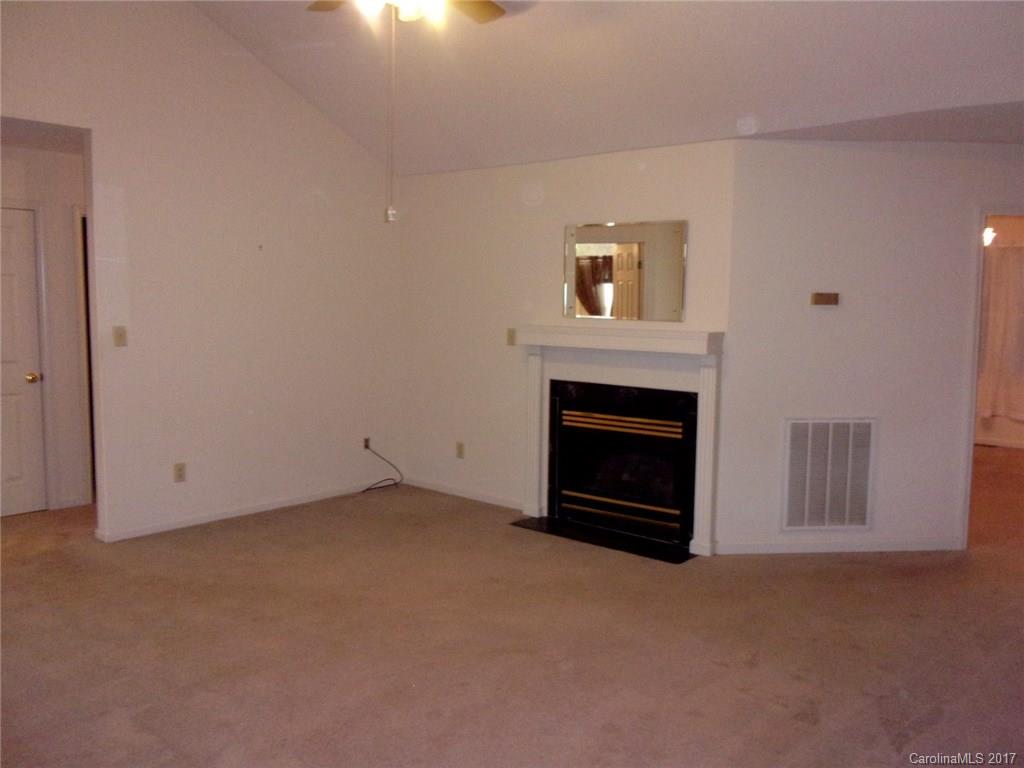 36074 Finger Road, Unit 2 Mount Pleasant, NC 28124 - Photo 5 of 21 a view of empty room with a fireplace