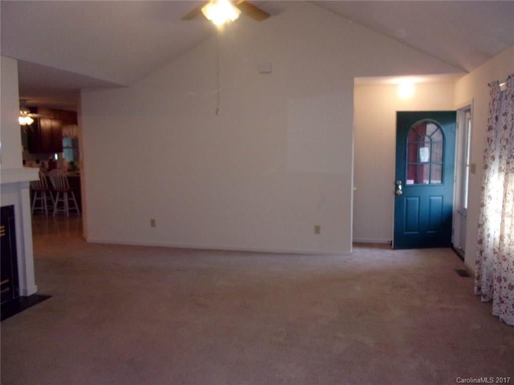 36074 Finger Road, Unit 2 Mount Pleasant, NC 28124 - Photo 6 of 21 an empty room with closet and a fireplace