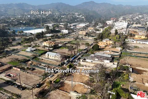 an aerial view of residential building and parking space