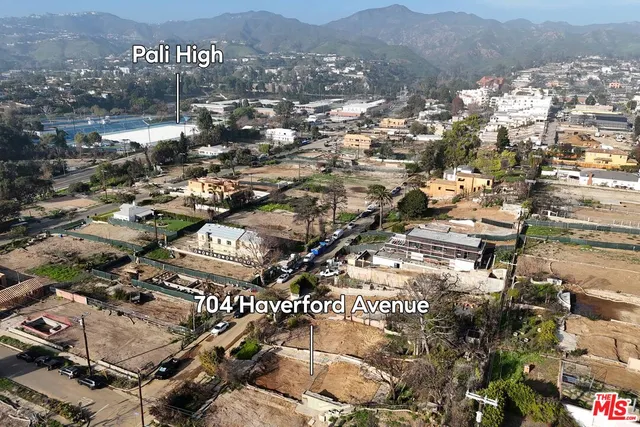 an aerial view of residential building and parking space