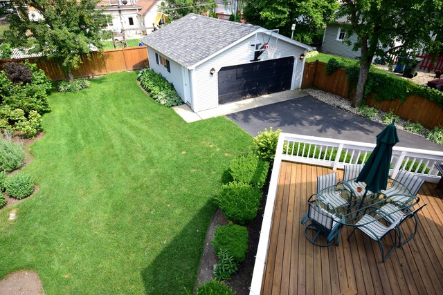 323 North Merrill Street Park Ridge, IL 60068 - Photo 22 of 25 a view of a deck and couches with wooden floor and fence