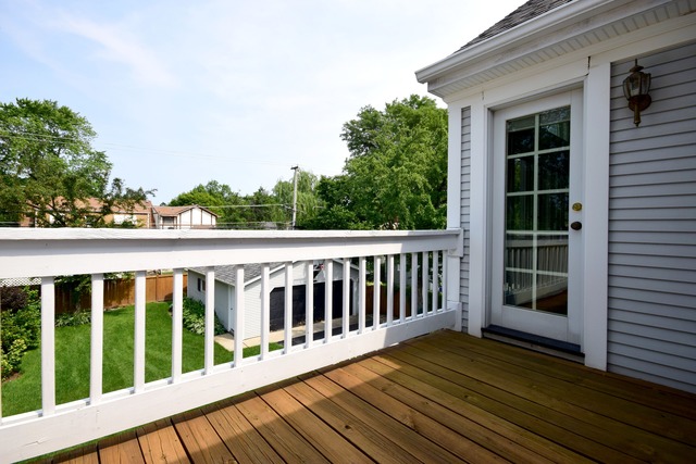 323 North Merrill Street Park Ridge, IL 60068 - Photo 24 of 25 a view of a wooden balcony with a floor to ceiling window and wooden fence