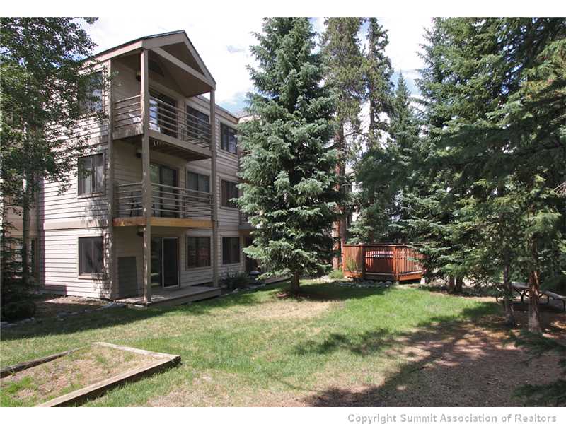 120 Sawmill Road, Unit 207 Breckenridge, CO 80424 - Photo 1 of 12 Exterior Back. The middle deck here is unit 207. The hot tub is in the fenced enclosure, for the private use of Wildwood owners and guests.