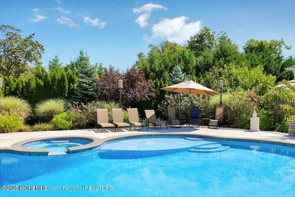 a view of a swimming pool with a patio