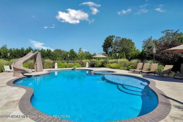 a view of a swimming pool with a patio