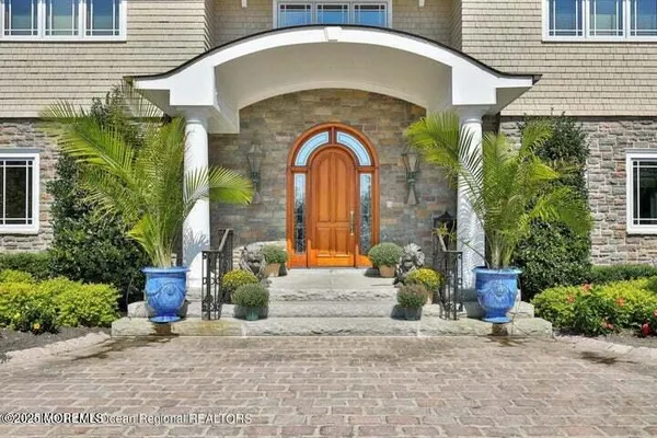 a front view of a house with outdoor space