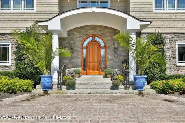 a front view of a house with outdoor space