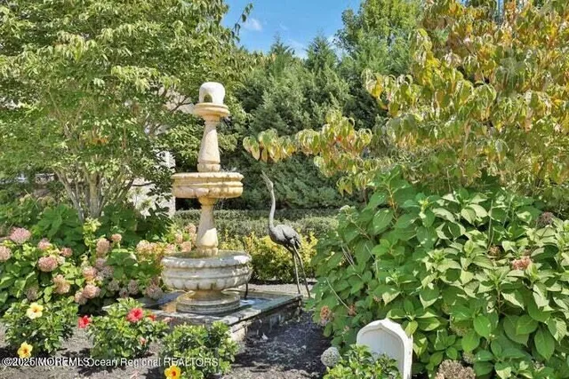 a view of a statue in a garden