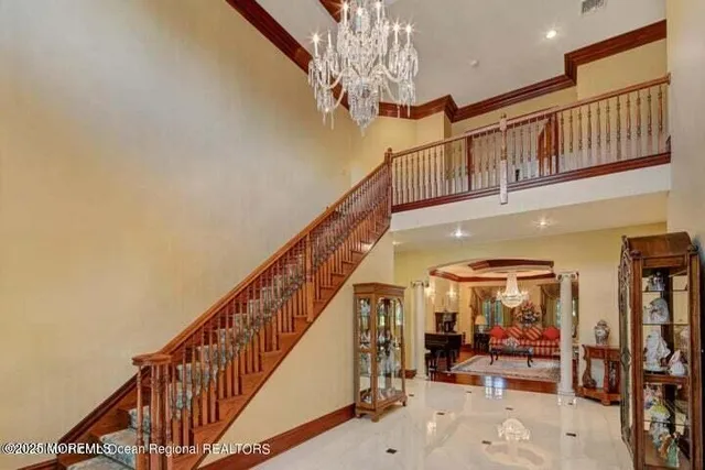 a view of a patio with a table and chairs under an umbrella