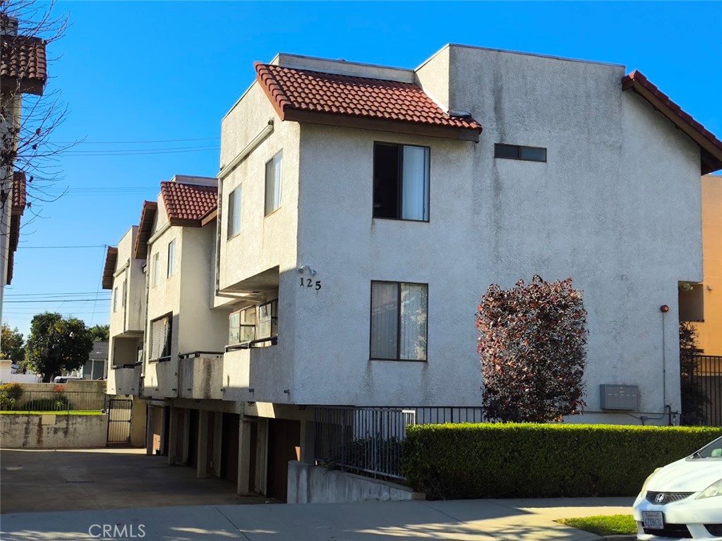 125 North 3rd Street, Unit D Alhambra, CA 91801 - Photo 1 of 16 a view of a house with a garden