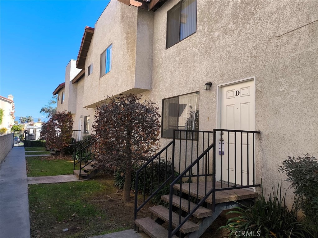 125 North 3rd Street, Unit D Alhambra, CA 91801 - Photo 15 of 16 a view of a street with brick wall and plants