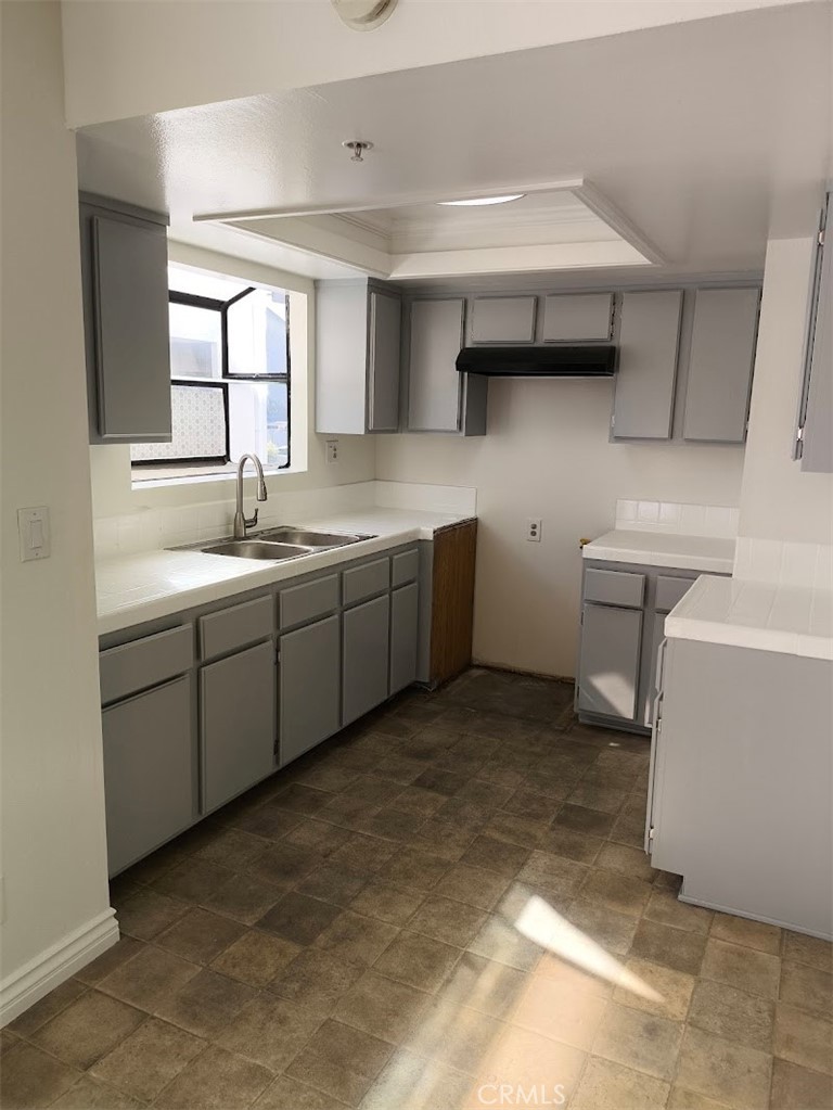 125 North 3rd Street, Unit D Alhambra, CA 91801 - Photo 5 of 16 a view of a sink and dishwasher in a bathroom