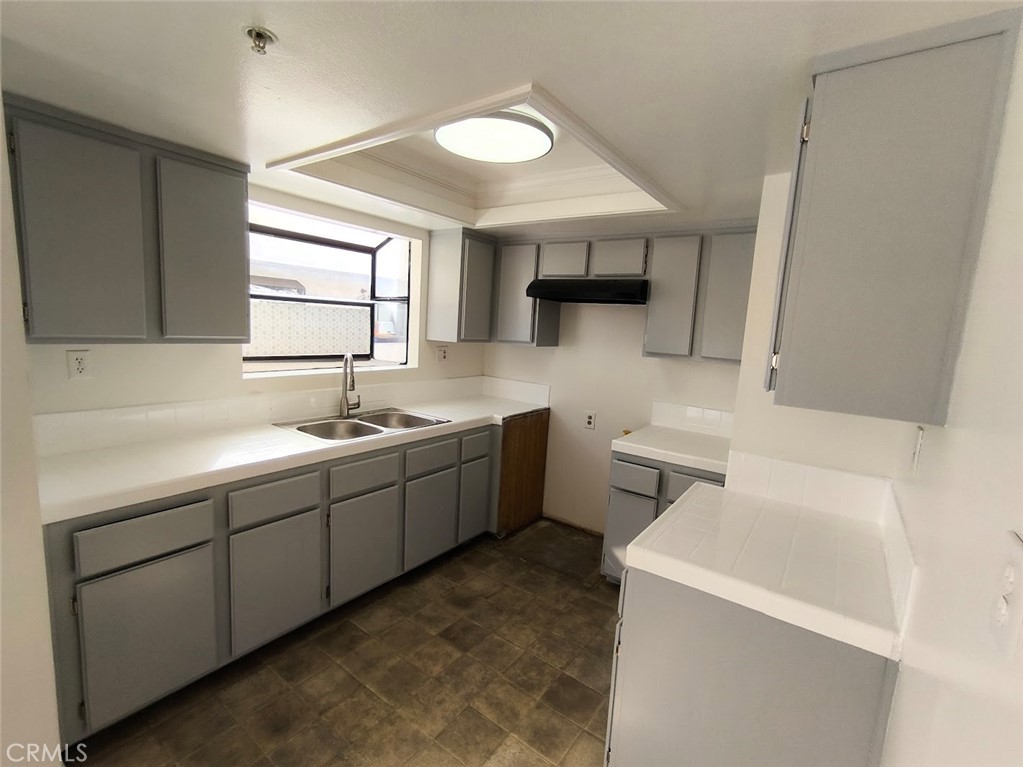 125 North 3rd Street, Unit D Alhambra, CA 91801 - Photo 6 of 16 a kitchen with a sink cabinets and window