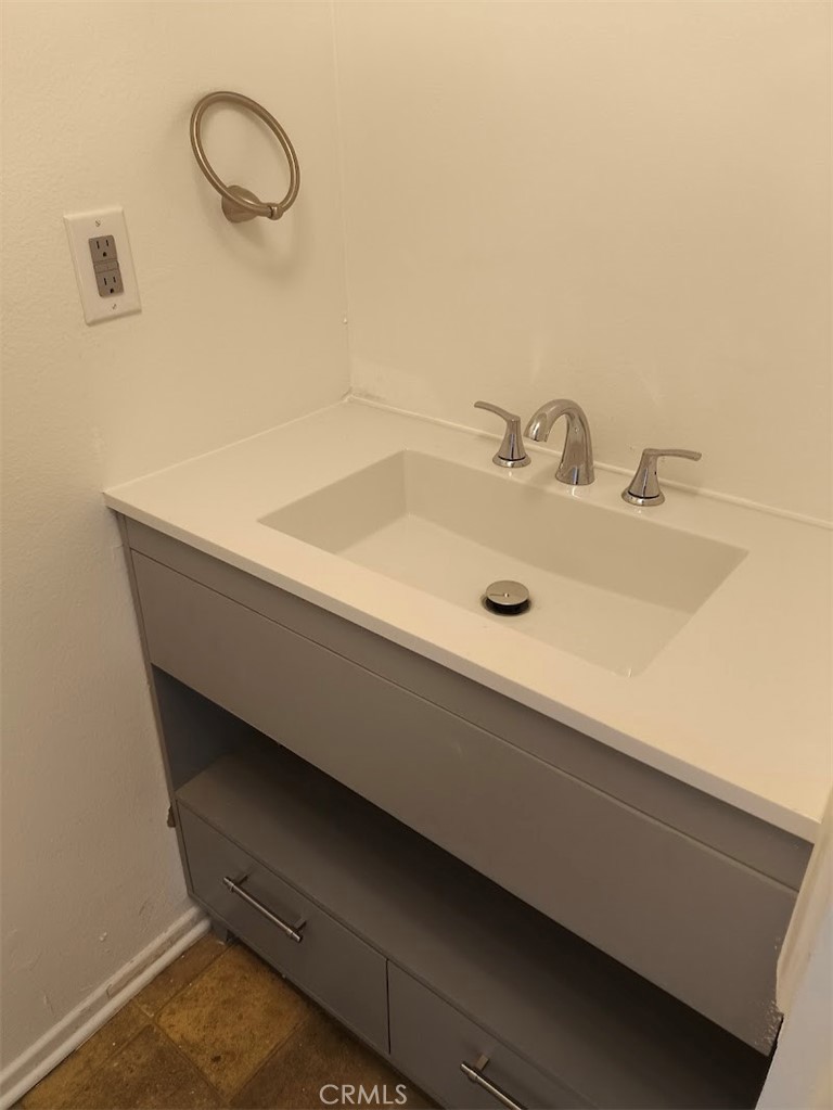 125 North 3rd Street, Unit D Alhambra, CA 91801 - Photo 7 of 16 a bathroom with a sink and a mirror