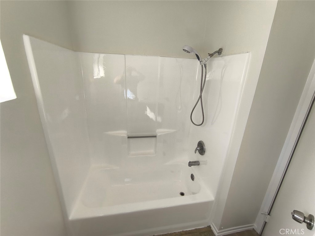 125 North 3rd Street, Unit D Alhambra, CA 91801 - Photo 10 of 16 a bathroom with a glass shower door