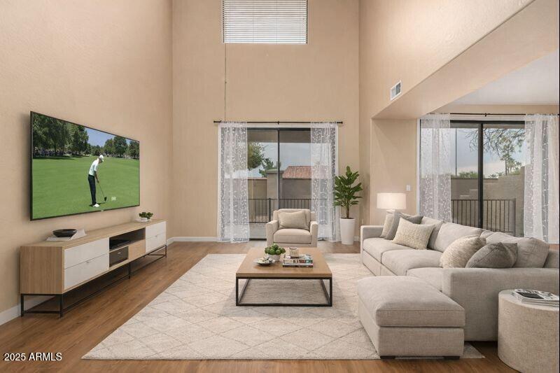 a living room with furniture and a flat screen tv