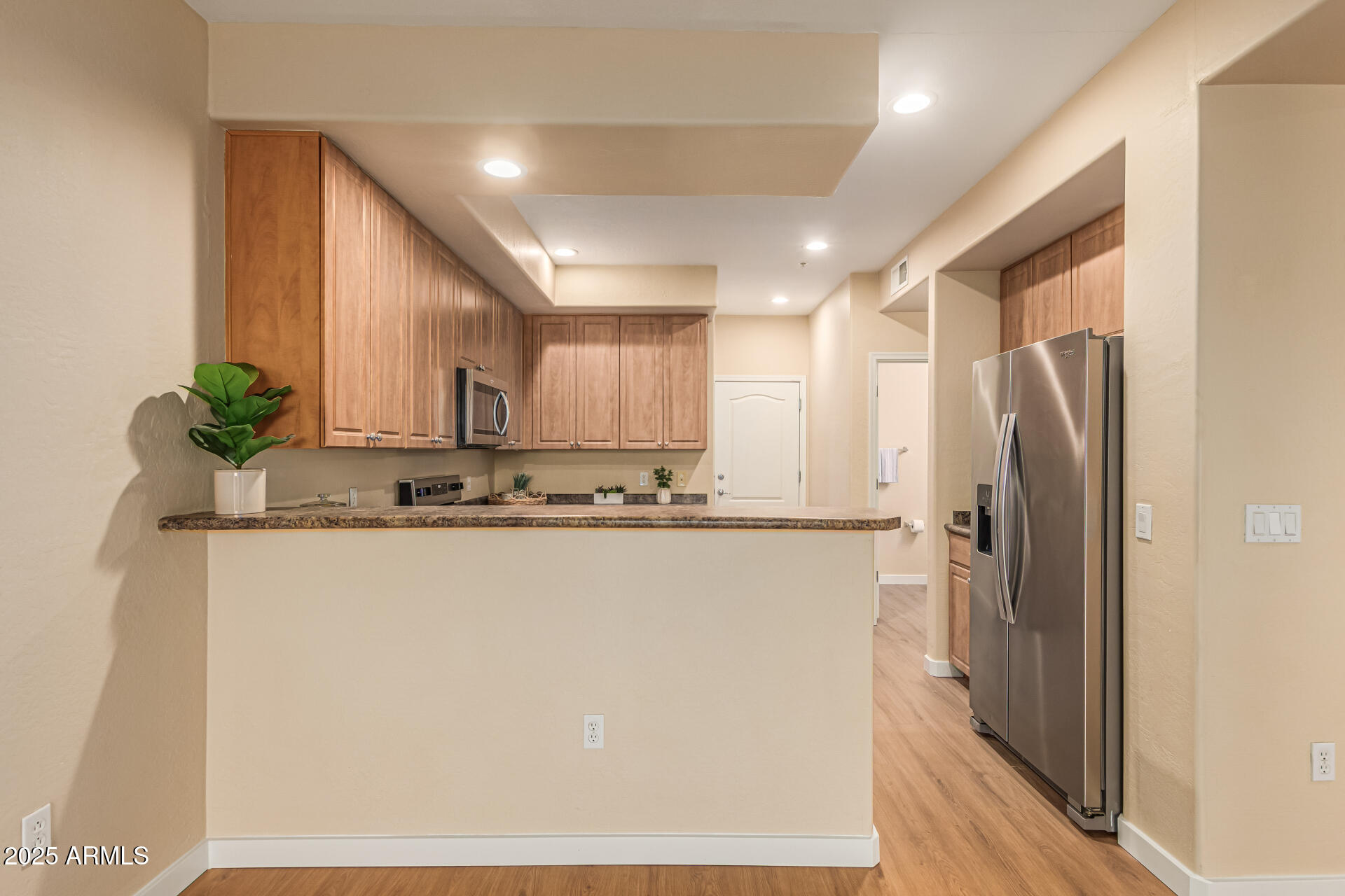 705 West Queen Creek Road, Unit 1201 Chandler, AZ 85248 - Photo 14 of 51 a view of a kitchen with a sink and refrigerator