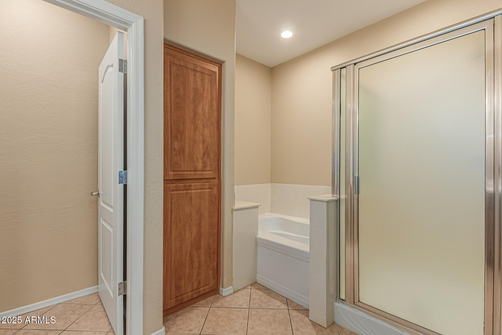 705 West Queen Creek Road, Unit 1201 Chandler, AZ 85248 - Photo 21 of 51 a bathroom with a bathtub and a shower