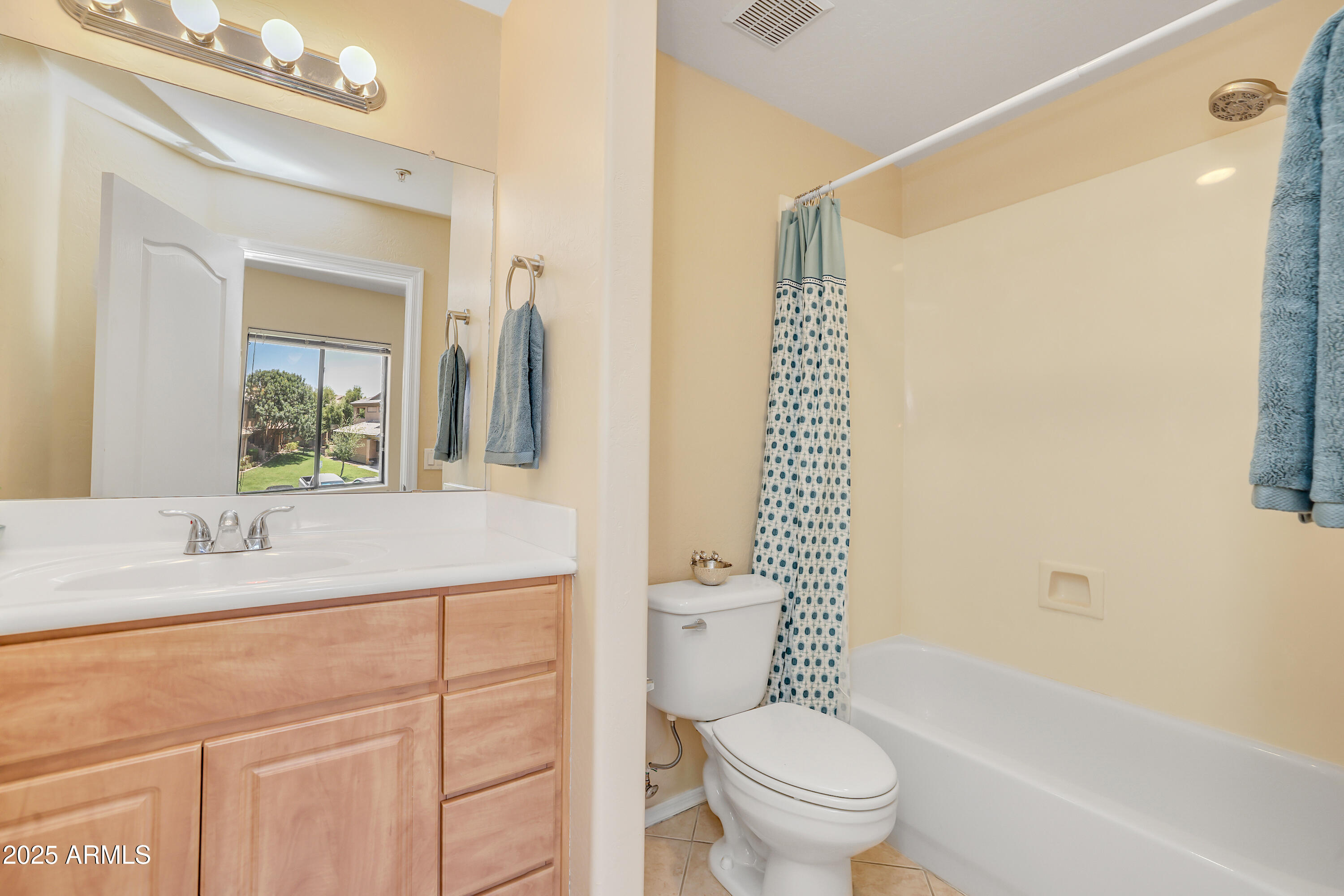 705 West Queen Creek Road, Unit 1201 Chandler, AZ 85248 - Photo 27 of 51 a bathroom with a granite countertop sink a toilet and a bathtub
