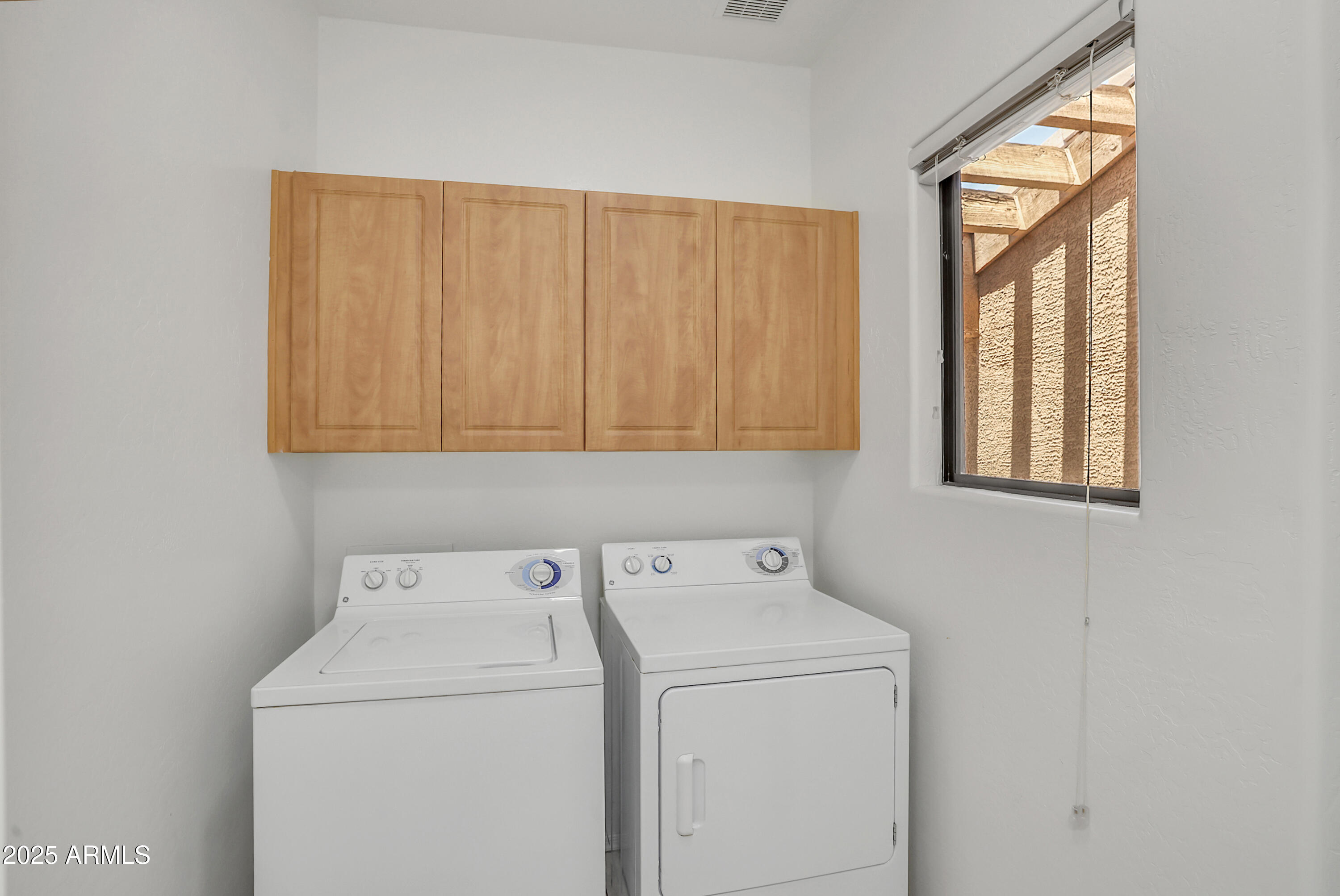 705 West Queen Creek Road, Unit 1201 Chandler, AZ 85248 - Photo 28 of 51 a utility room with dryer and washer