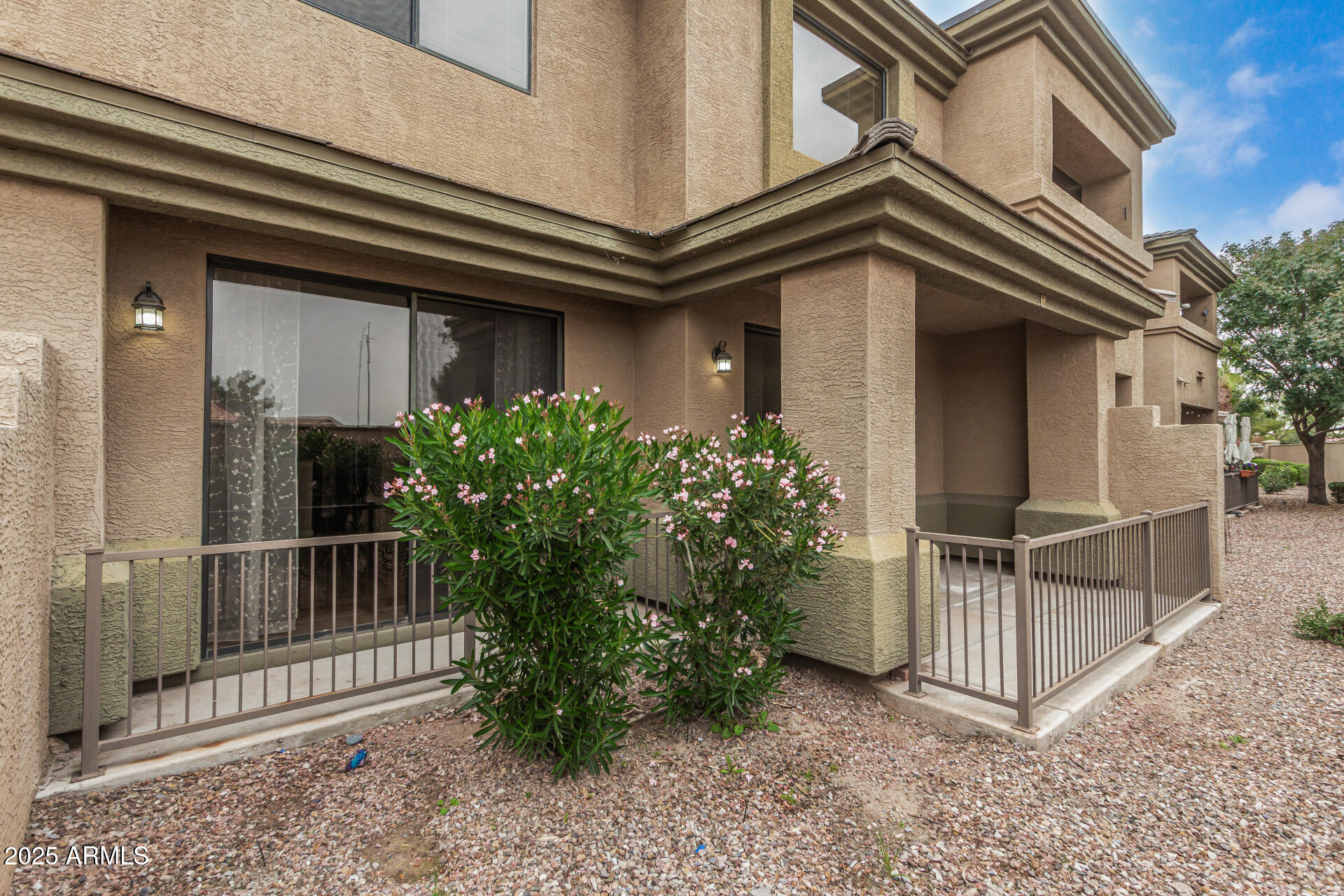 705 West Queen Creek Road, Unit 1201 Chandler, AZ 85248 - Photo 34 of 51 a view of a house with a small yard and plants