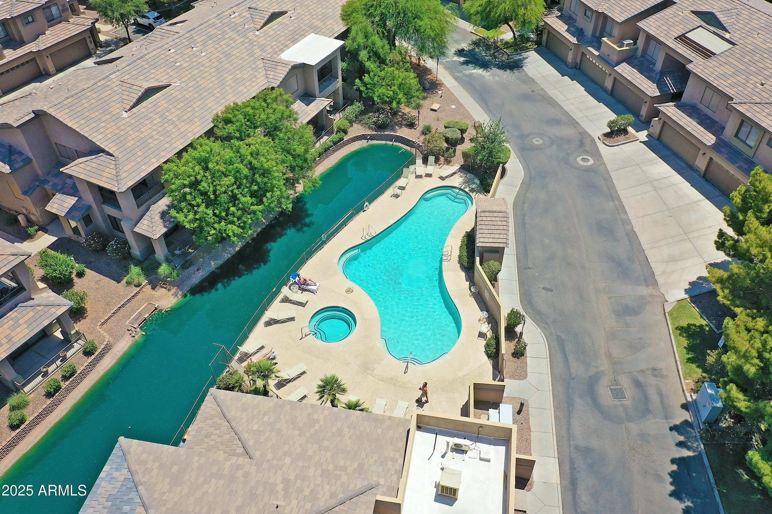 705 West Queen Creek Road, Unit 1201 Chandler, AZ 85248 - Photo 39 of 51 an aerial view of a house with a swimming pool