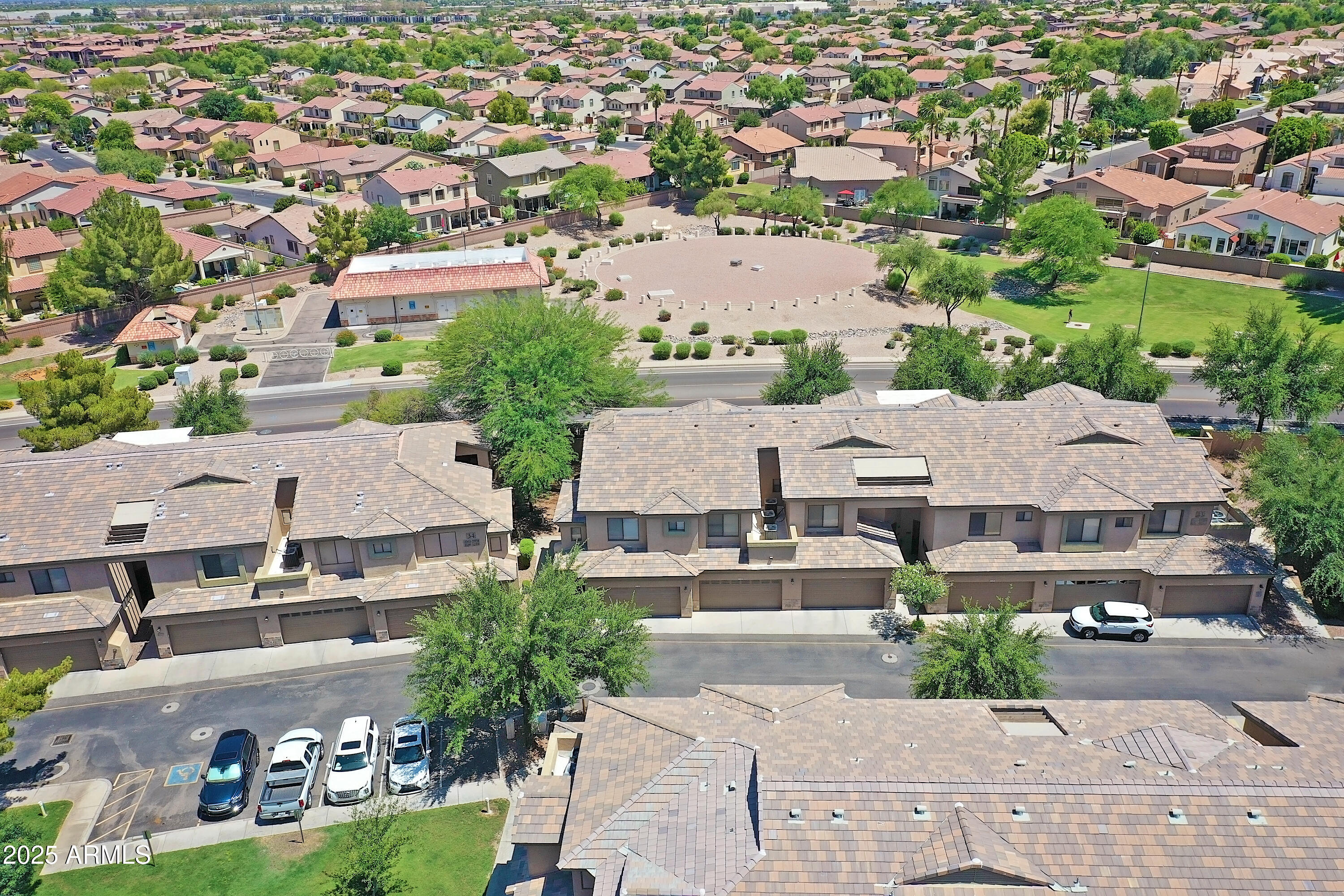 705 West Queen Creek Road, Unit 1201 Chandler, AZ 85248 - Photo 43 of 51 an aerial view of residential houses with outdoor space and parking