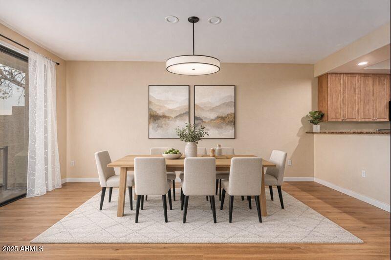 705 West Queen Creek Road, Unit 1201 Chandler, AZ 85248 - Photo 4 of 51 a view of a dining room with furniture window and wooden floor