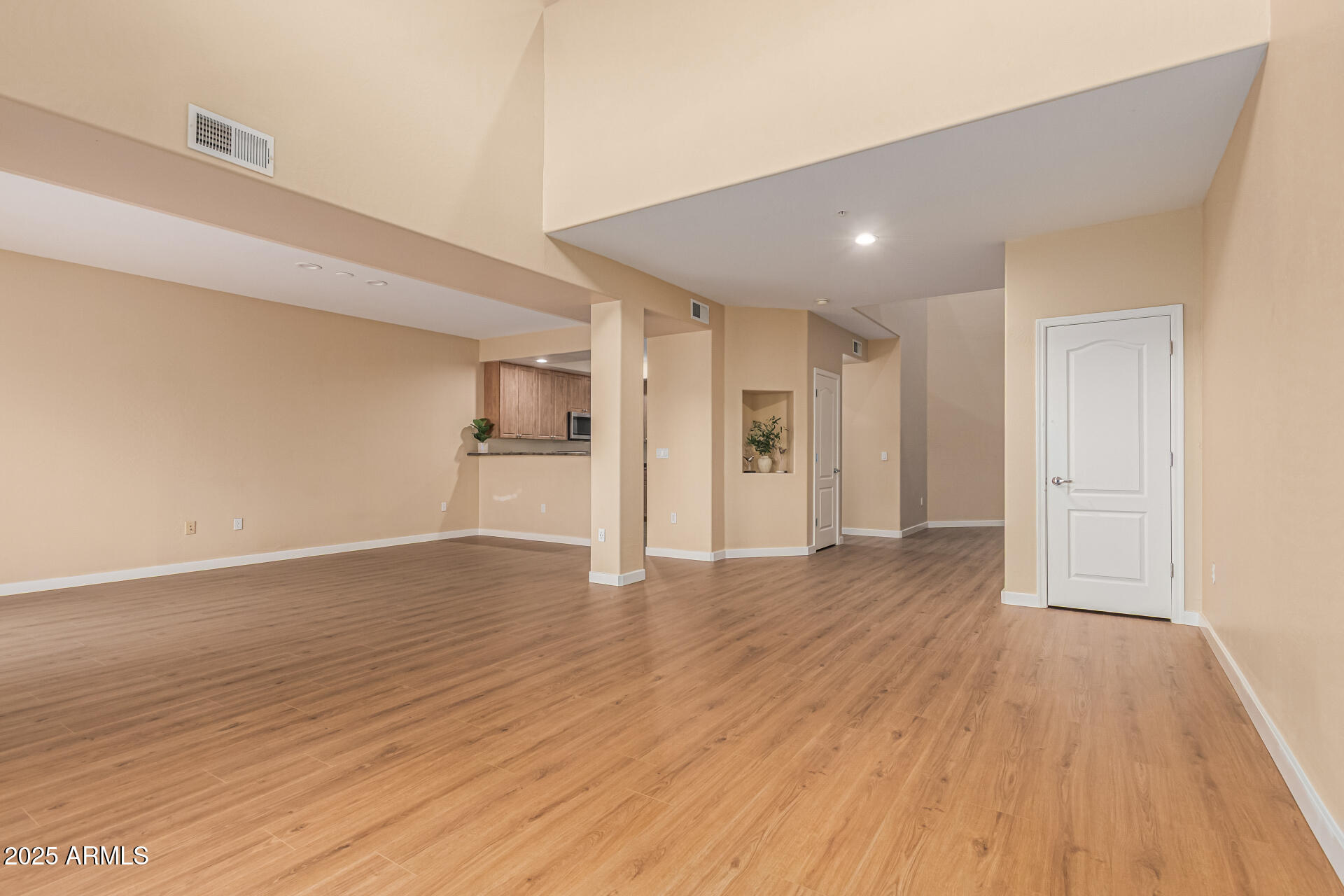 705 West Queen Creek Road, Unit 1201 Chandler, AZ 85248 - Photo 6 of 51 a view of empty room with wooden floor