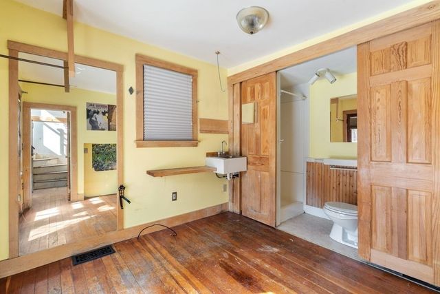 a view of a bathroom with a tub and a window