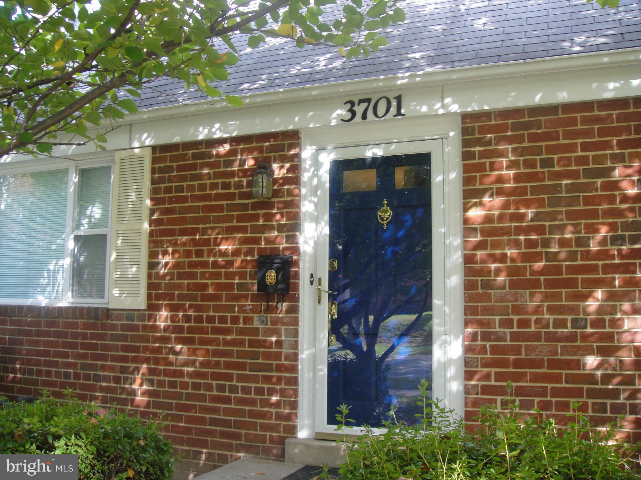 3701 Kayson Street Silver Spring, MD 20906 - Photo 2 of 30 a view of a brick building with a brick wall