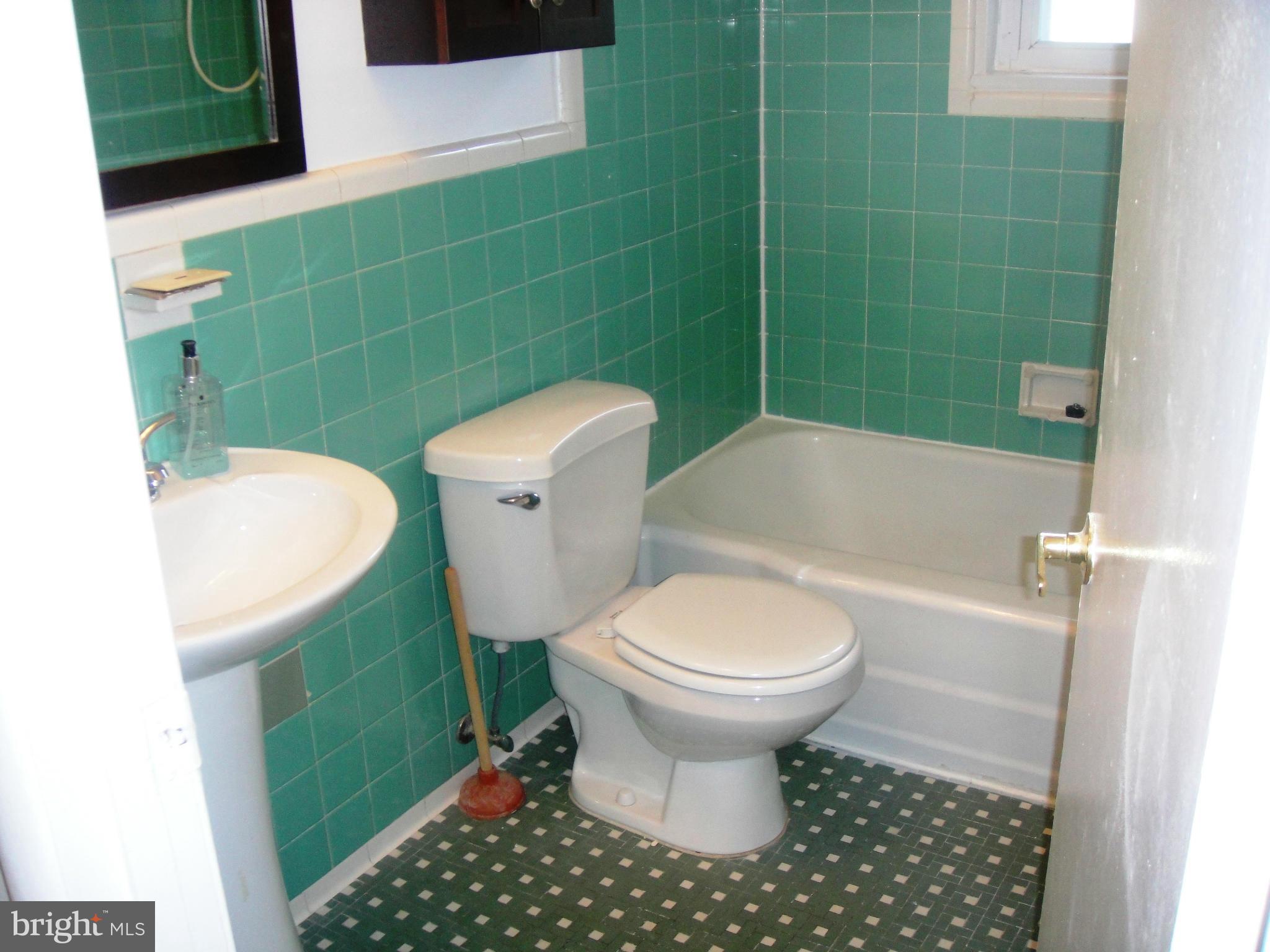 3701 Kayson Street Silver Spring, MD 20906 - Photo 12 of 30 a bathroom with a sink toilet and a bathtub