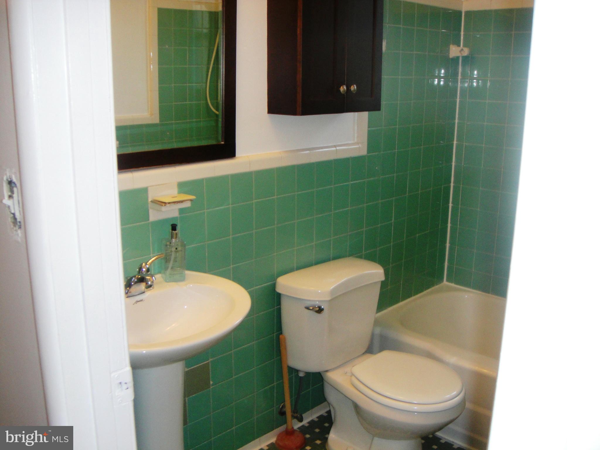 3701 Kayson Street Silver Spring, MD 20906 - Photo 13 of 30 a bathroom with a toilet a sink and mirror