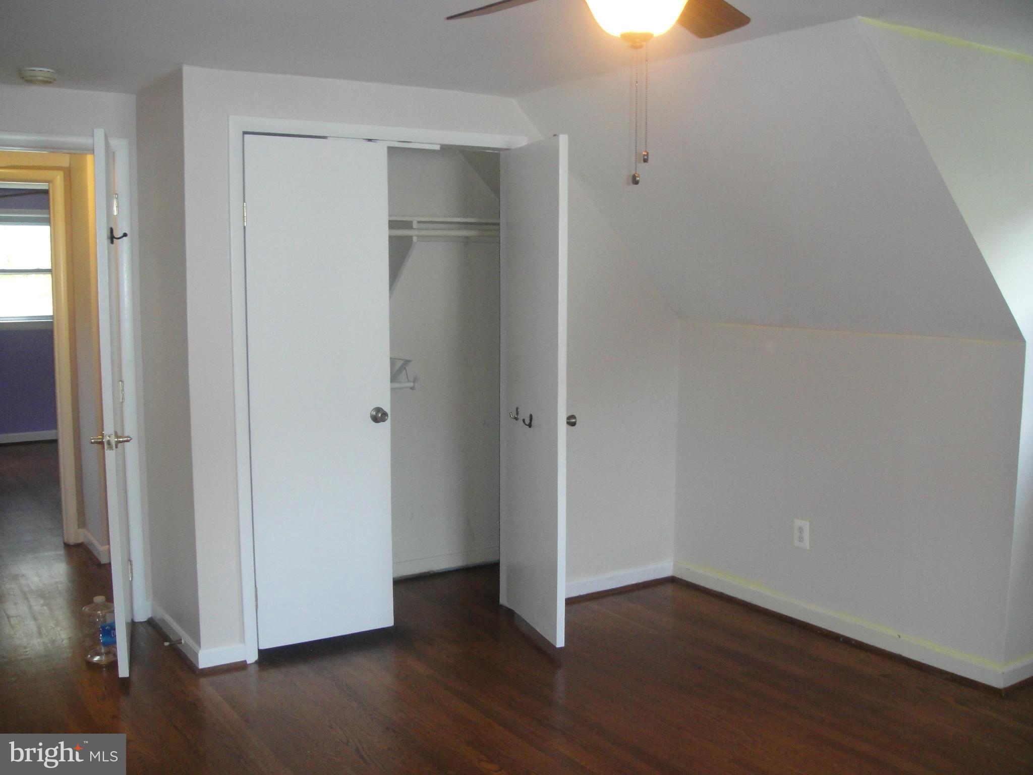 3701 Kayson Street Silver Spring, MD 20906 - Photo 18 of 30 an empty room with wooden floor closet and windows